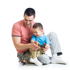 Father and son with helicopter toy