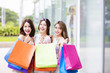 © Tom Wang - young Women group Carrying Shopping Bags On Street