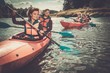© Nejron Photo - Happy best friends having fun on a kayaks