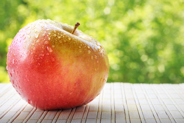 Apple on green background