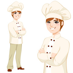 Young chef man in beige uniform standing with arms crossed