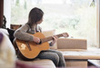 © Johnér - Teenage girl playing guitar