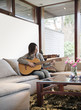 © Johnér - Teenage girl playing guitar