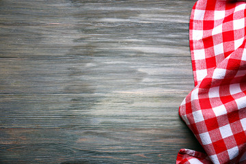 Wall Mural - Checkered napkin on wooden background