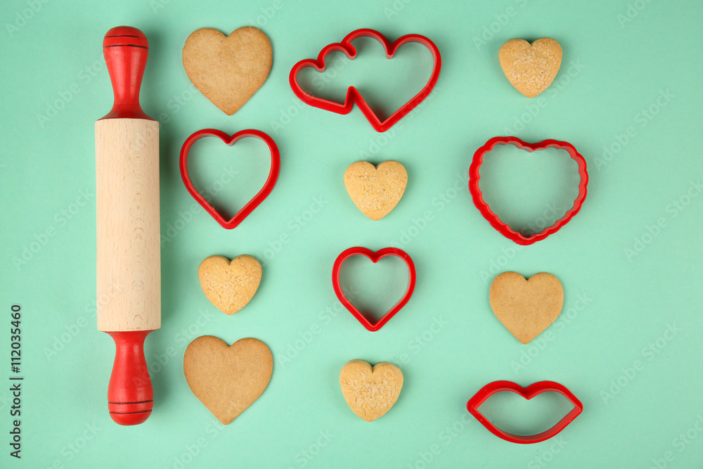 Cookies in heart shape for Valentine's Day on turquoise background