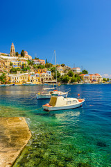 Wall Mural - The picturesque coast of the island of Symi, a popular tourist destination, Symi island, Dodecanese, Greece.