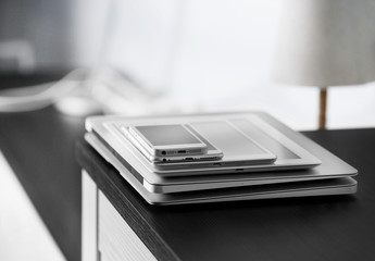 Poster - Pile of electronic gadgets on the table. Communication and technology concept