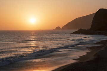 Wall Mural - The Pacific ocean during sunset. Landscape with blue sea, the mountains and the dusk sky, the USA, Santa Monica. 