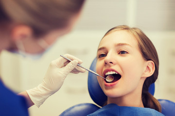 Poster - female dentist checking patient girl teeth