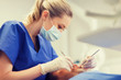 © Syda Productions - female dentist checking up male patient teeth