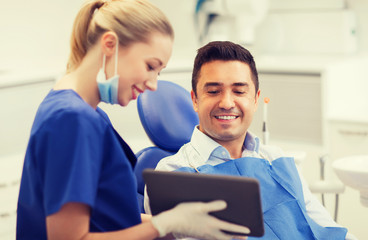 Sticker - female dentist with tablet pc and male patient