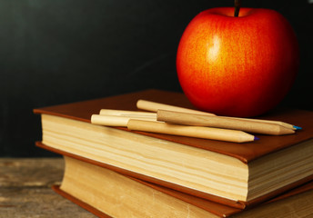 Poster - School books on desk near chalkboard