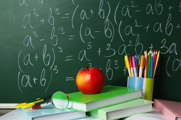 Poster - School books on desk near chalkboard