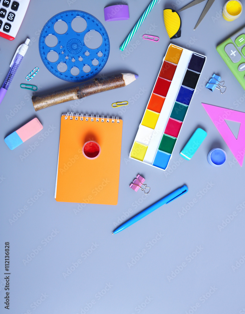 Set of stationery on grey table, top view