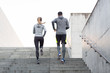 Leinwandbild Motiv couple running upstairs on city stairs