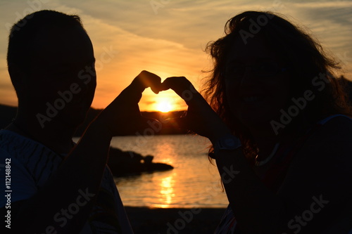 Couple D Amoureux Sur La Plage De Capriccioli Au Coucher Du Soleil Sardaigne Italie Stock Photo Adobe Stock Couple D Amoureux Sur La Plage De Capriccioli Au Coucher Du Soleil Sardaigne Italie Stock Photo Adobe Stock