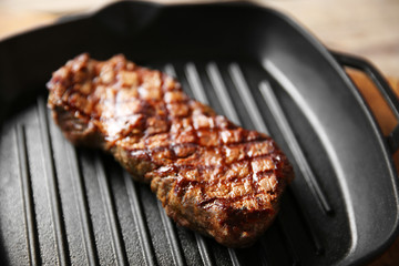 Sticker - Grilled steak on grill pan, closeup