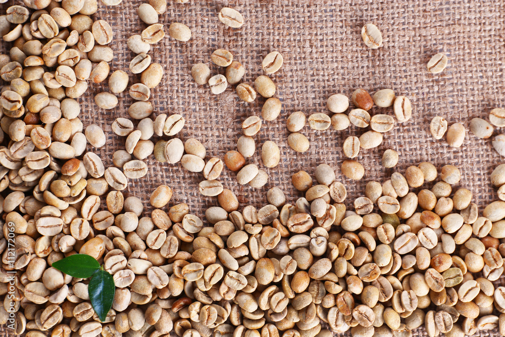 Green coffee beans on sackcloth