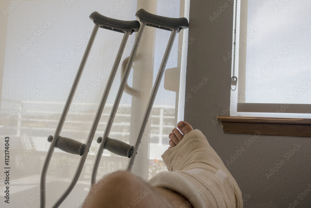 Disabled Injured Person With Sprained Or Broken Ankle Or