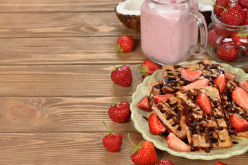 Canvas Print - Viennese waffles with chocolate sauce and strawberries