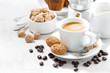 cup of espresso and cookies on a white table