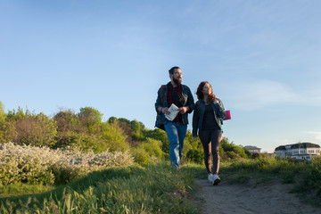 couple goes hiking, forest, recreation, love, active lifestyle, the concept of love and traveling