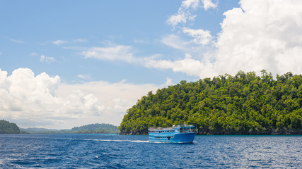 Wall Mural - Obsolete wooden ferry boat carrying passenger to the scenic Togean (or Togian) Islands, Central Sulawesi, upgrowing travel destination in Indonesia.