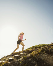 Caucasian Woman Jogging Uphill