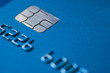 © echobg - Credit Card blue with chip partial number selective focus close up macro empty space atm emv