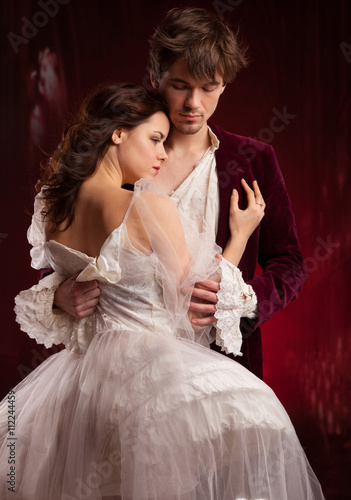 Fotografie, Obraz pretty young lady in old time and man in red medieval dress