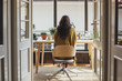 © Lumina Images/Blend Images - Woman sitting at desk