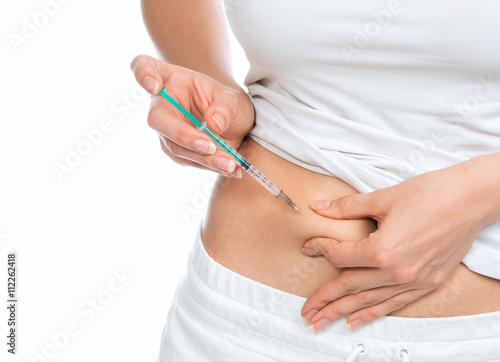 Fotografía Medical diabetes insulin syringe injection shot into abdomen wit
