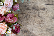 Rose Flowers On Rustic Wooden Background. Copy Space.