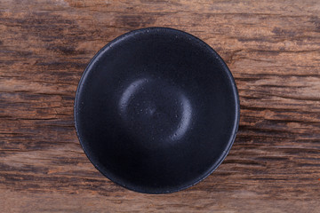 Wall Mural - Empty bowl on wood