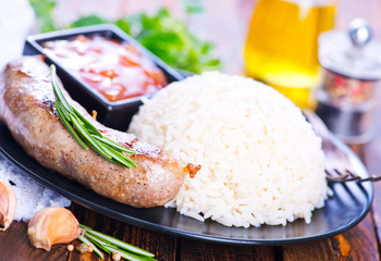 Canvas Print - boiled rice with sausages