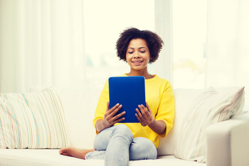 Canvas Print - happy african american woman with tablet pc