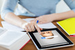 © Syda Productions - close up of student with tablet pc and notebook