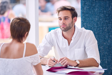 Wall Mural - Businessman paying attention to his female partner during business meeting