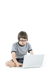 Wall Mural - young boy in grey t-shirt with laptop