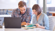 © nakophotography - Adult male and female business partners busy working in office