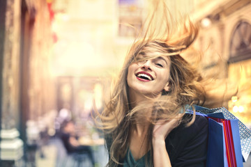 Wall Mural - Happy woman doing shopping