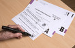 © petert2 - Completing a postal ballot paper with a cross in a box to leave the European Union.