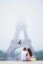 Beautiful Romantic Couple Near The Eiffel Tower In Paris