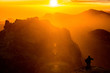 © ernestorageitos - Man playing accordion on mountain landscape at sunset