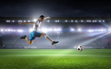 Fototapeta Sport - Soccer player hitting ball