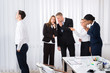 © Andrey Popov - Businesspeople Gossiping In Office