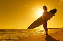 Surfer Girl On The Beach