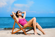 © Acronym - Young, sporty, beautiful and happy woman relaxing