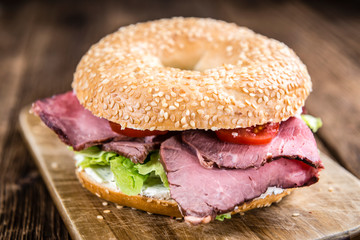 Sticker - Bagel (with Roast Beef) on vintage background