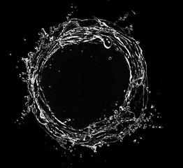 Wall Mural - Water splash circle isolated on black background